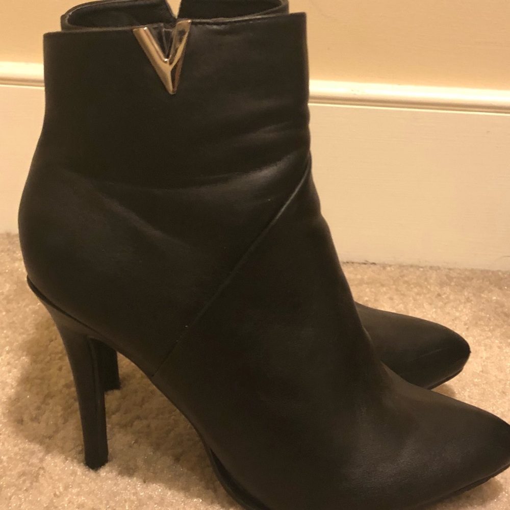Lightly worn booties with V cut on side